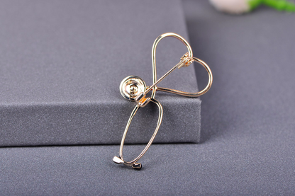 Creative stethoscope brooch